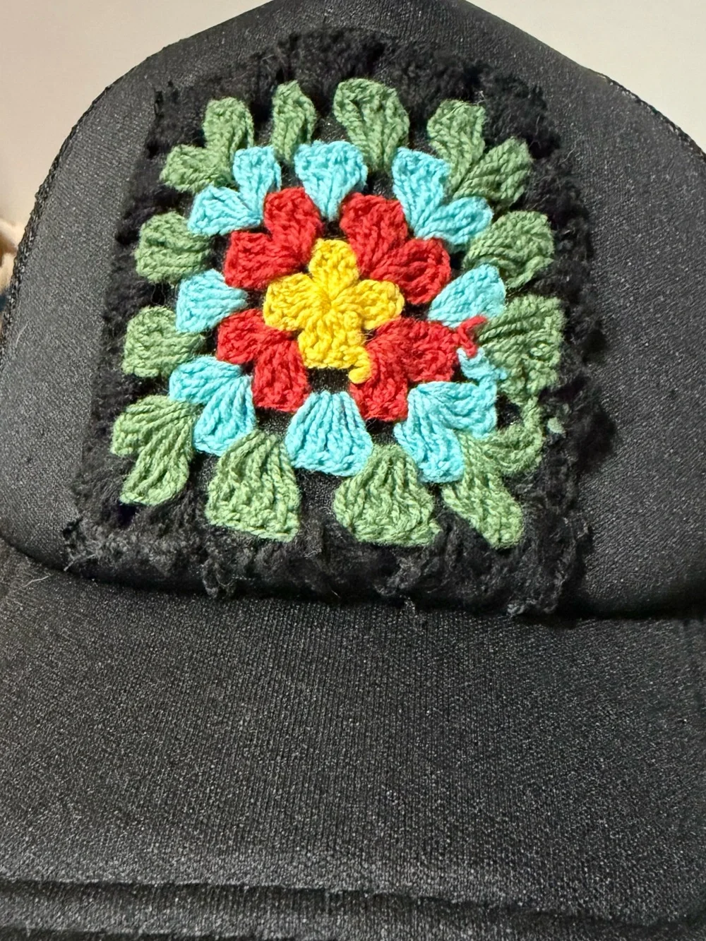 Black Truckers Hat with Crochet Granny Square.